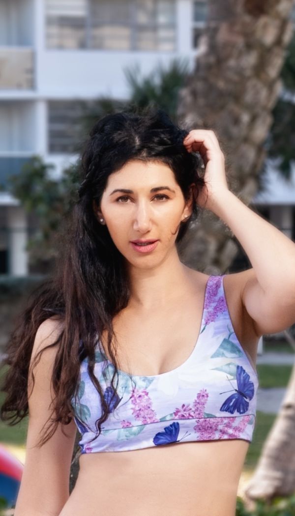 Model wearing lilac butterfly tankini swim top